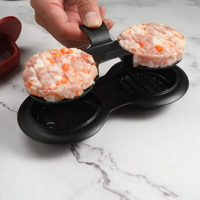 Black and red food-grade ABS plastic burger press with non-stick round moulds.