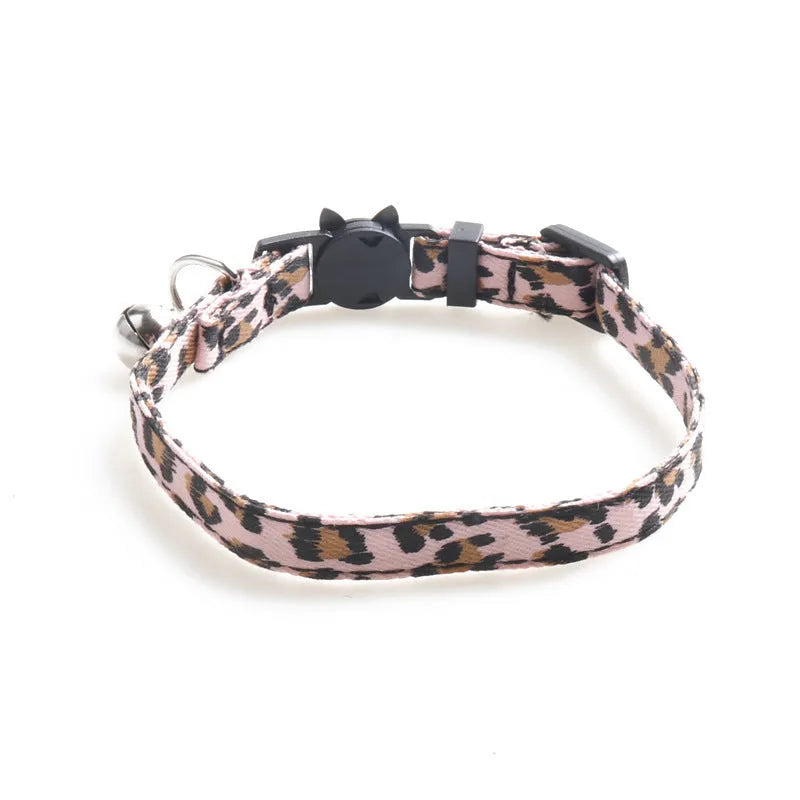 Cloth cat collar with bell, 1.0 by 28 cm, shown in brown, green and pink colour options