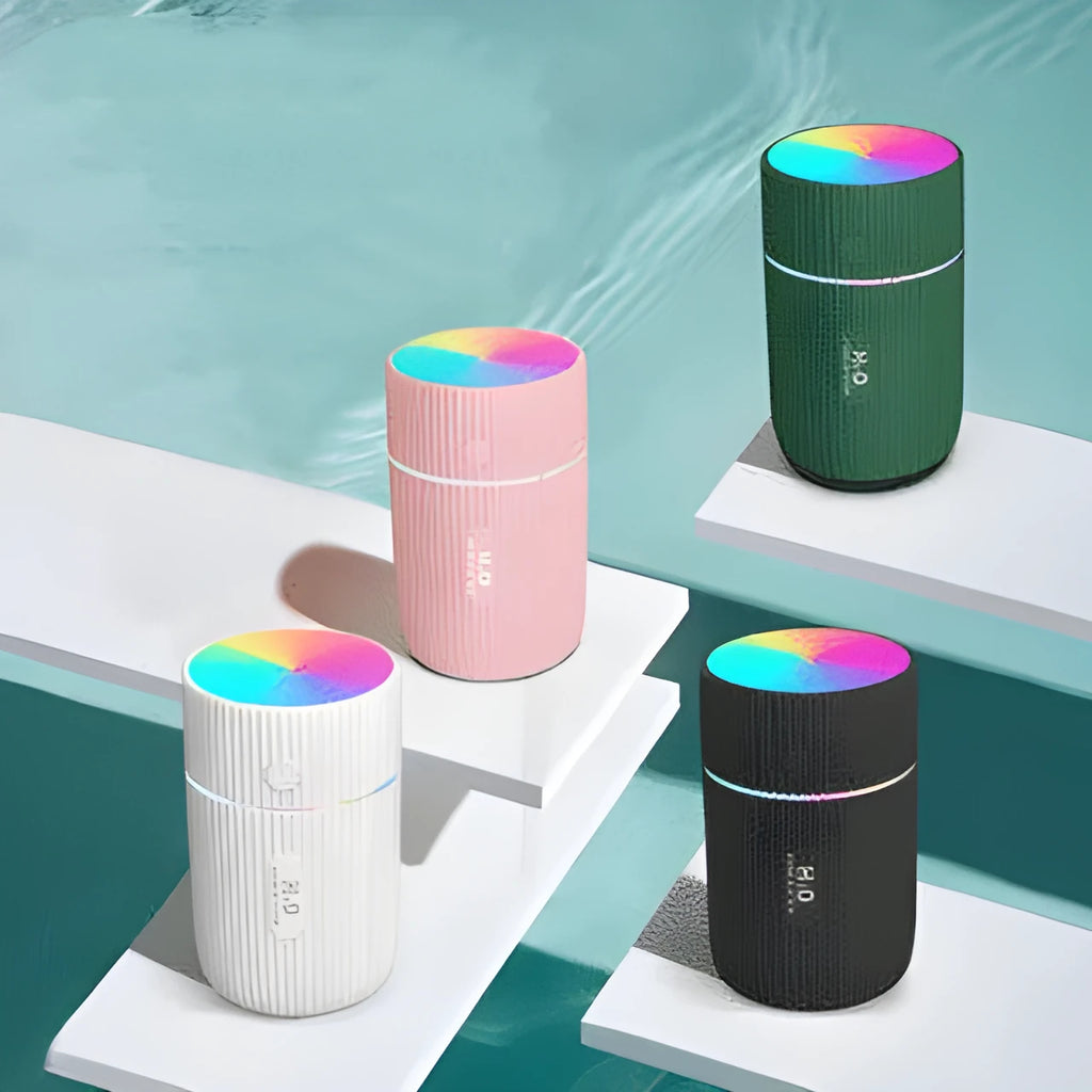 Portable ultrasonic essential oil diffuser humidifier in black, green, pink, or white with USB cable