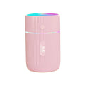 Portable ultrasonic essential oil diffuser humidifier in black, green, pink, or white with USB cable