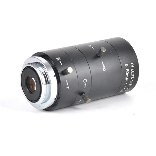 Black 6-60mm manual aperture and focus camera lens with CS mount on a table.