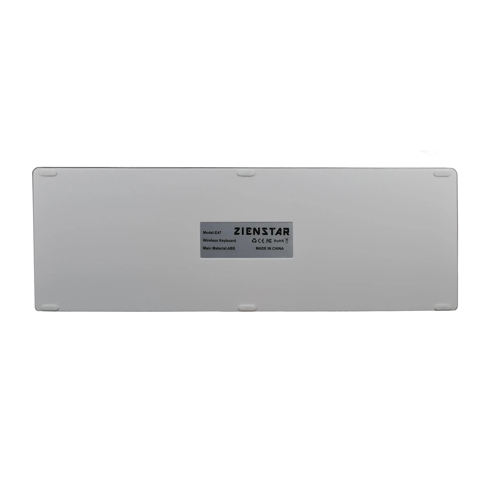White universal rechargeable Bluetooth keyboard next to a tablet on a desk.