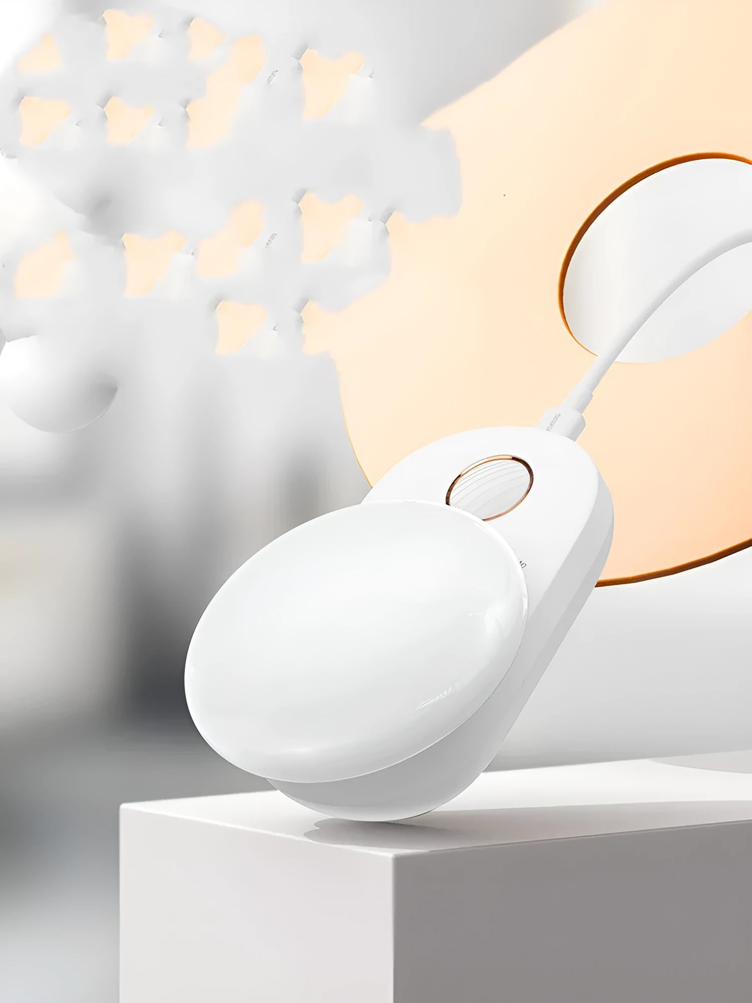 White Baseus rechargeable motion sensor bedside night light with LED glow, shown on a table.