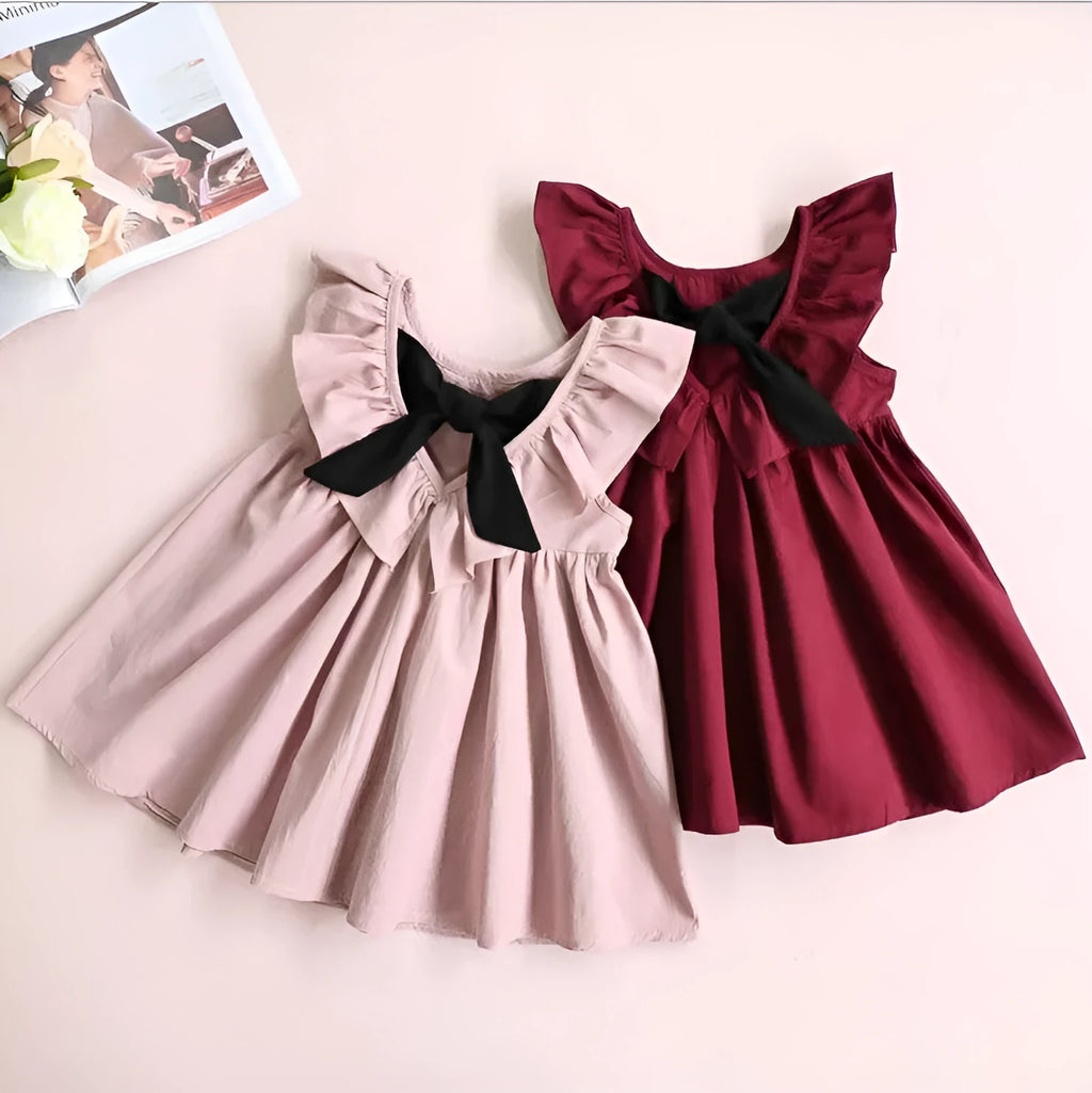 Girls' cotton pleated halter dress with bow detail in pink or wine red, sizes 90cm to 130cm for ages 3 to 8