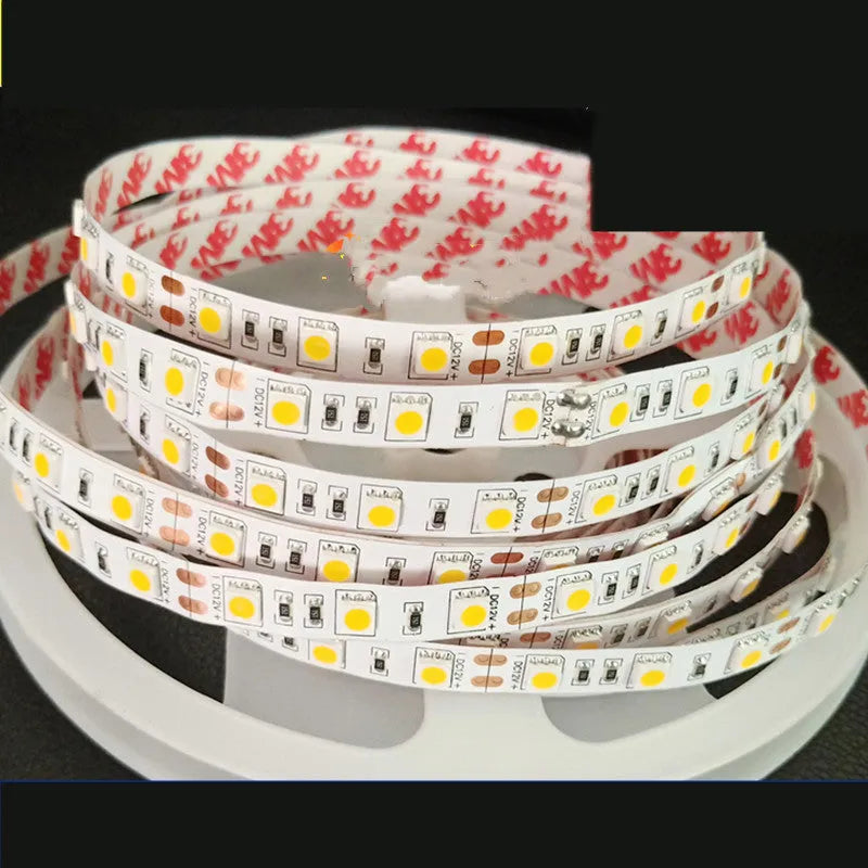 12V white LED light strip on a flexible belt for shelf and counter lighting in shops.