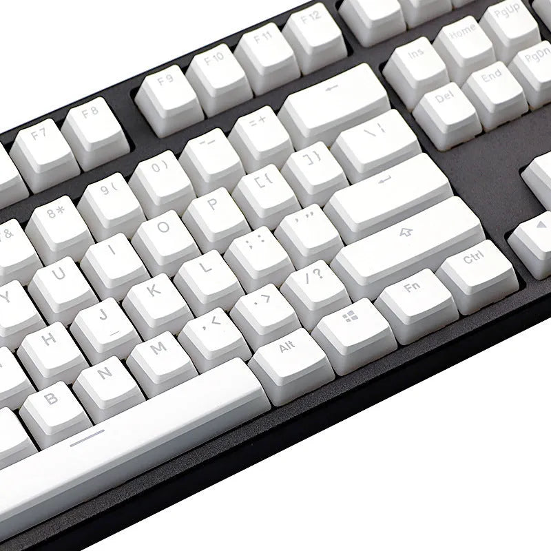 White pudding-style PBT keycap set with 141 pieces showing dye-sublimated legends on mechanical keyboard
