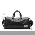 Black large capacity PU leather waterproof sports gym bag with multiple internal pockets and handles.
