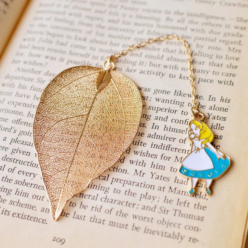 KC alloy bookmark with Alice, rabbit, clock, and leaf charms on kraft packaging