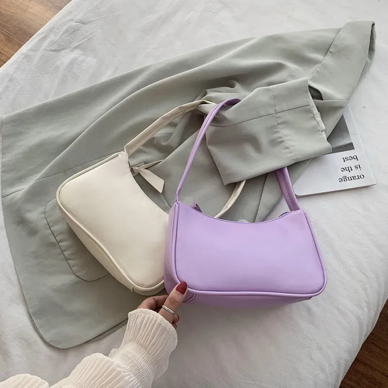 Women's one-shoulder armpit bag in PU leather with zipper closure and colour contrast design, medium size