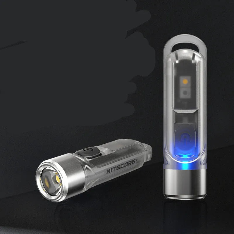 Green Nitecore TIKI USB-C rechargeable mini keychain light with multiple LEDs.