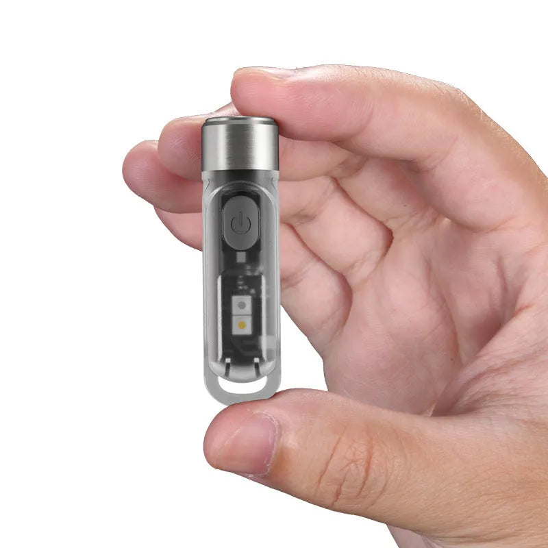 Green Nitecore TIKI USB-C rechargeable mini keychain light with multiple LEDs.