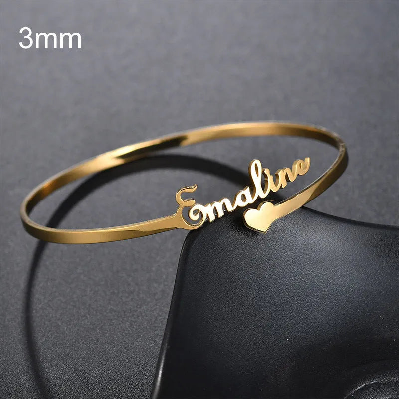Customized name bracelet in stainless steel with silver, gold, or rose gold finish and 3mm, 6mm, or 10mm size options.