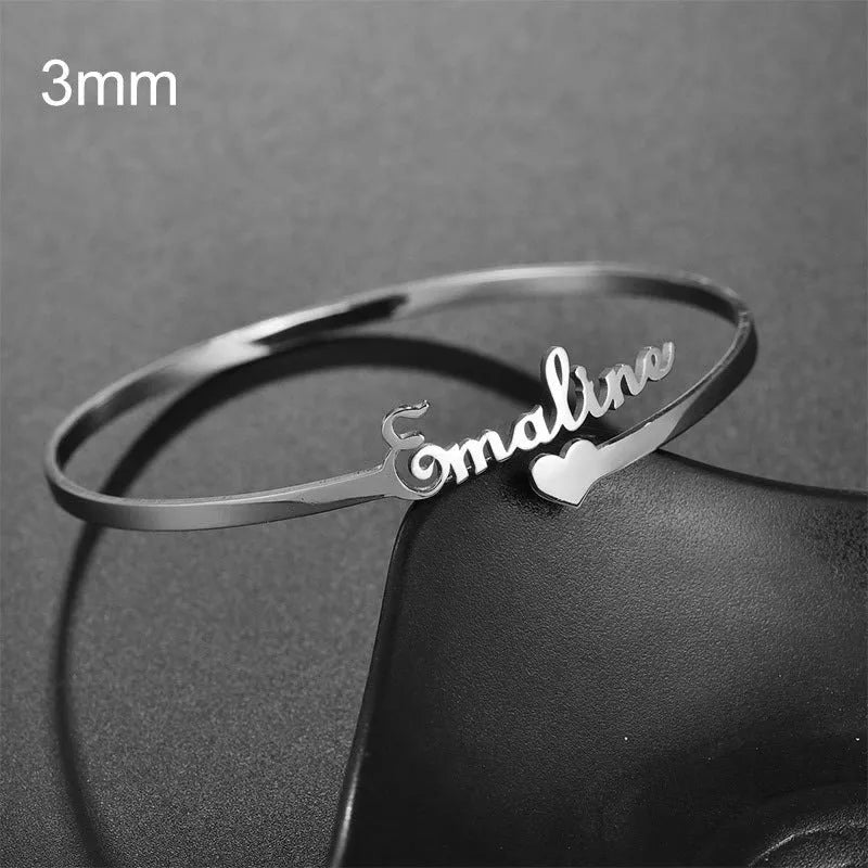 Customized name bracelet in stainless steel with silver, gold, or rose gold finish and 3mm, 6mm, or 10mm size options.