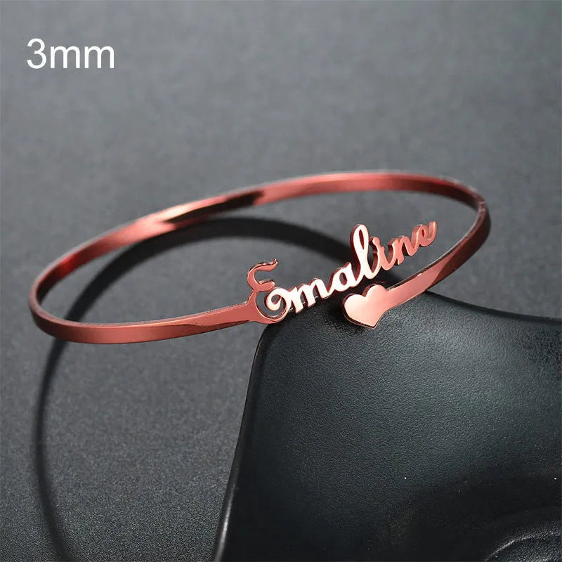Customized name bracelet in stainless steel with silver, gold, or rose gold finish and 3mm, 6mm, or 10mm size options.