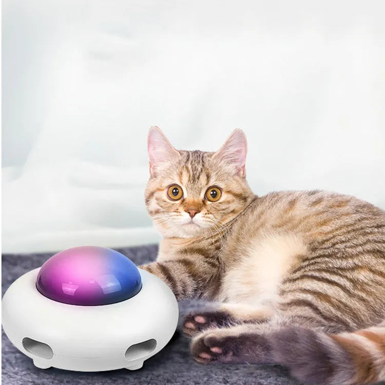 UFO electric cat toy with vibration activation, showing UFO body, feathers, and cleaning rings on a surface