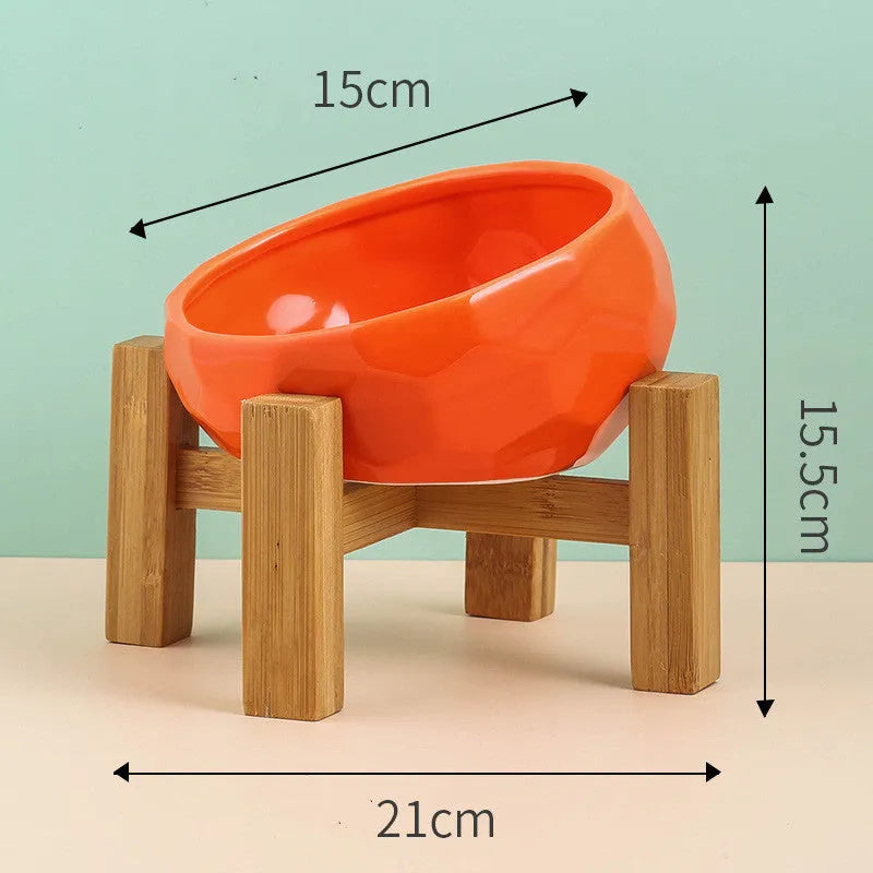 Ceramic cat bowl with oblique mouth design in white colour option on a surface