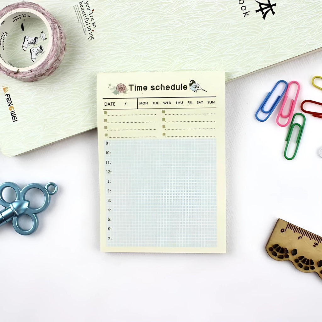 A5 weekly monthly work plan diary notebook open showing one of four design style layouts.