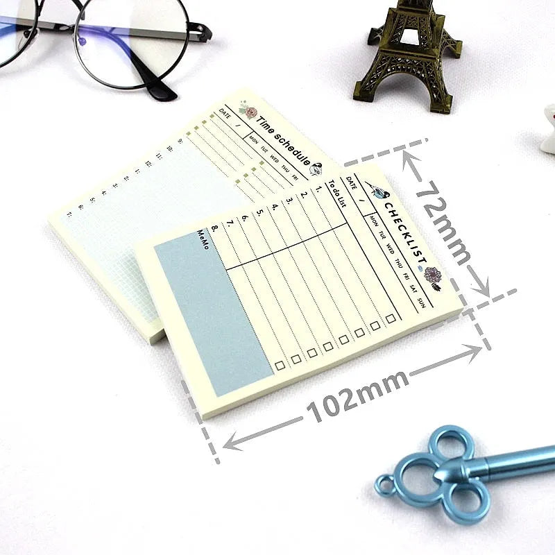 A5 weekly monthly work plan diary notebook open showing one of four design style layouts.