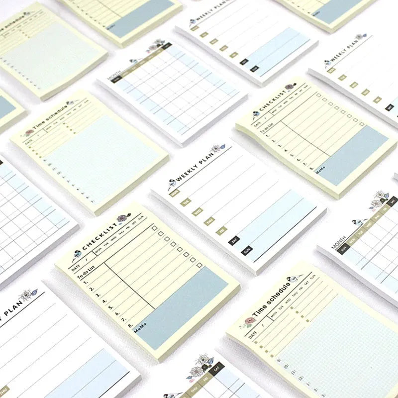 A5 weekly monthly work plan diary notebook open showing one of four design style layouts.