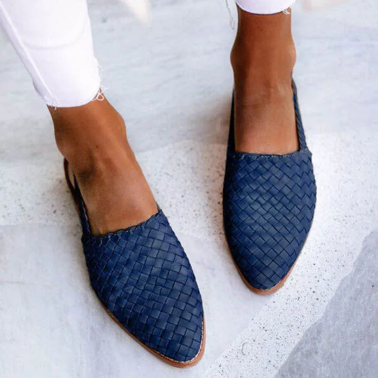 Women's flat sandals with a buckle and pointed toe in multiple colour options.