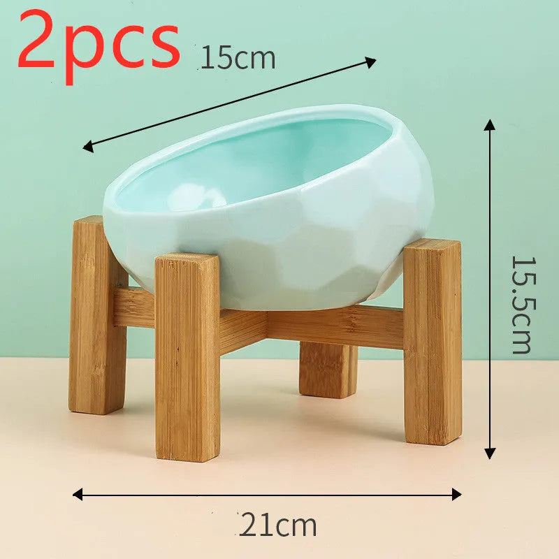 Ceramic cat bowl with oblique mouth design in white colour option on a surface