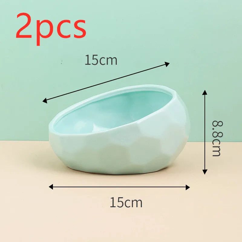 Ceramic cat bowl with oblique mouth design in white colour option on a surface