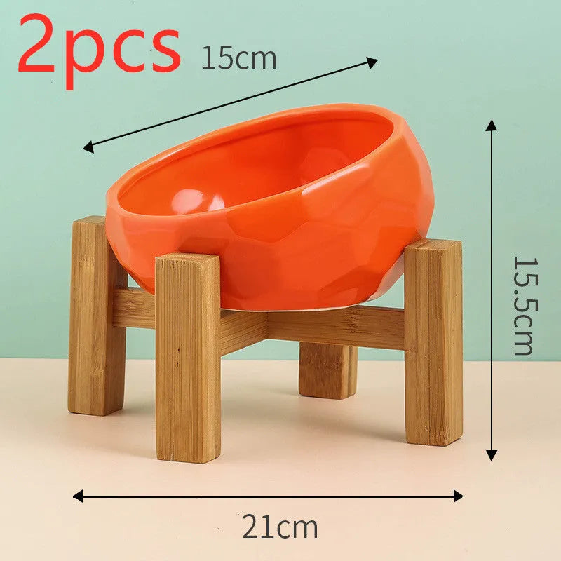 Ceramic cat bowl with oblique mouth design in white colour option on a surface
