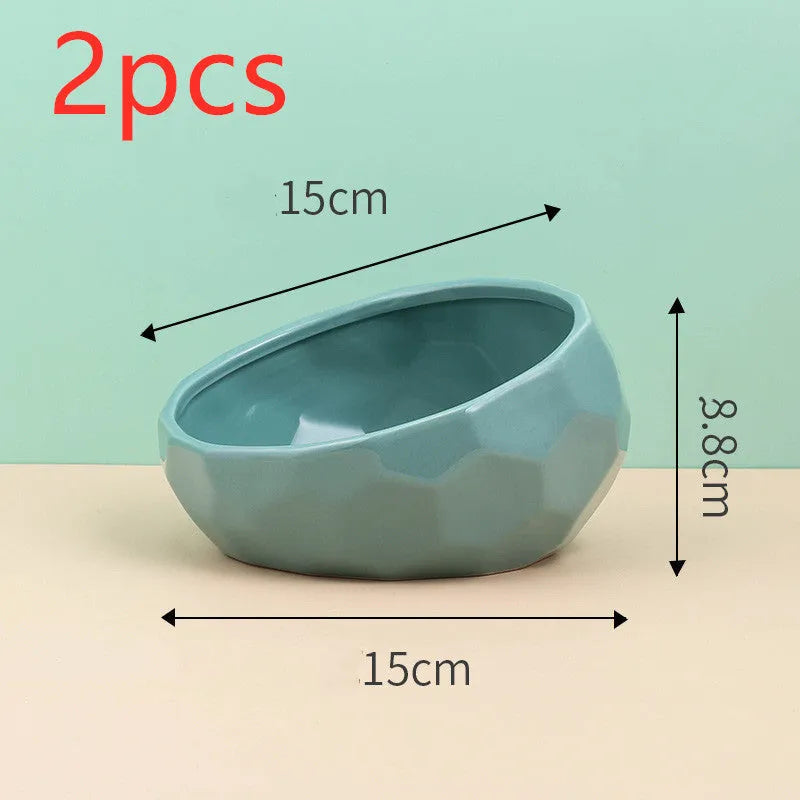 Ceramic cat bowl with oblique mouth design in white colour option on a surface