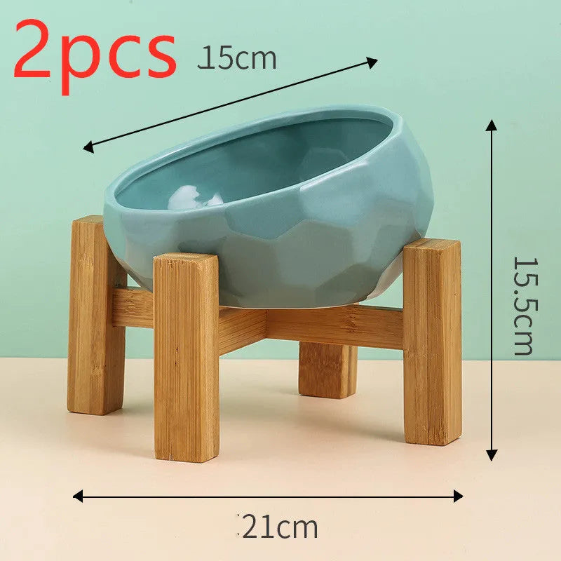 Ceramic cat bowl with oblique mouth design in white colour option on a surface