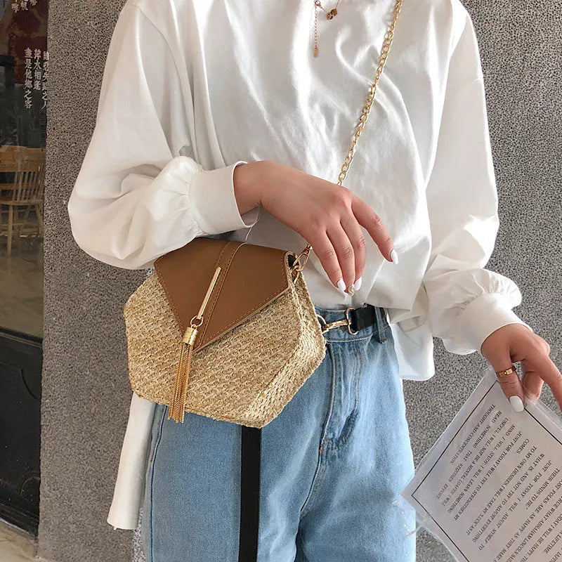 Women's woven straw shoulder bag with chain handle, lock closure, available in black brown green white