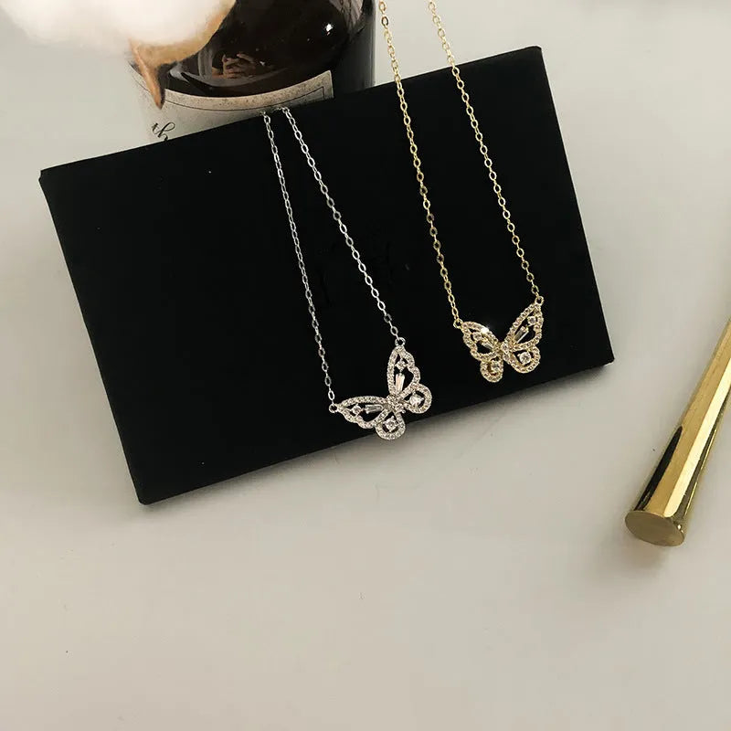 Butterfly pendant necklace with micro-inlaid zircon and water wave chain in gold colour