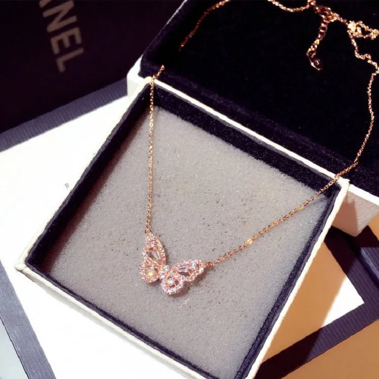 Butterfly pendant necklace with micro-inlaid zircon and water wave chain in gold colour