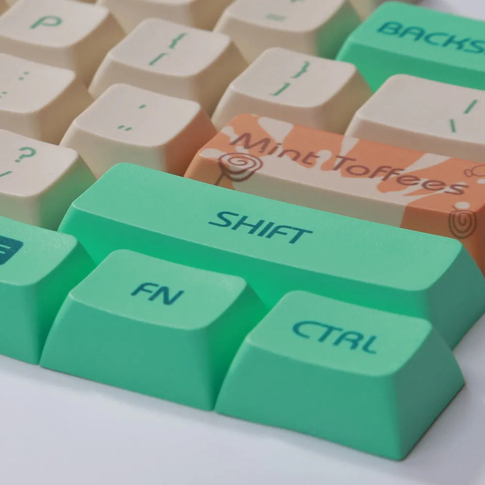 Mint toffee coloured DSA profile PBT keycap set arranged for an XDA104 mechanical keyboard.