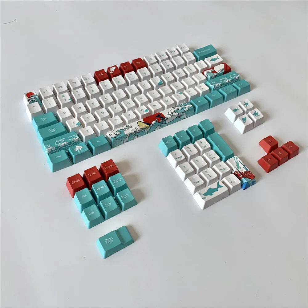 Coral Sea 108 keycap set for mechanical keyboard with blue gradient keys and multimedia legends on a white desk