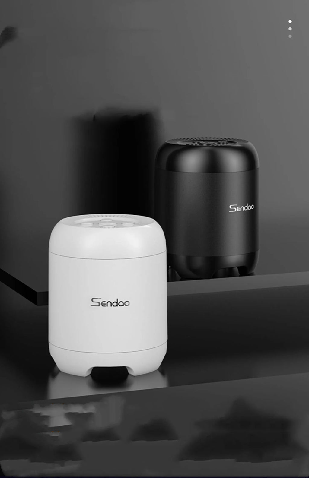 Small black or white cube-shaped Bluetooth speaker with SD card slot and USB port for charging.