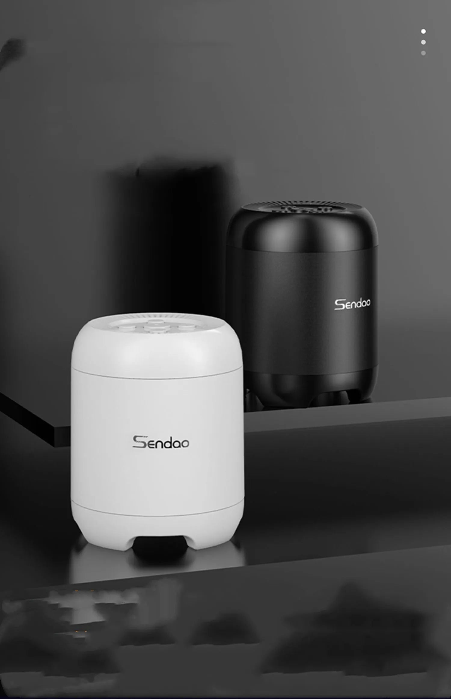 Small black or white cube-shaped Bluetooth speaker with SD card slot and USB port for charging.