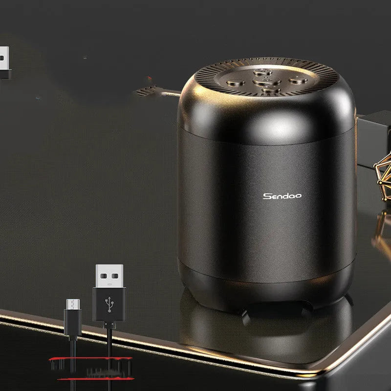 Small black or white cube-shaped Bluetooth speaker with SD card slot and USB port for charging.
