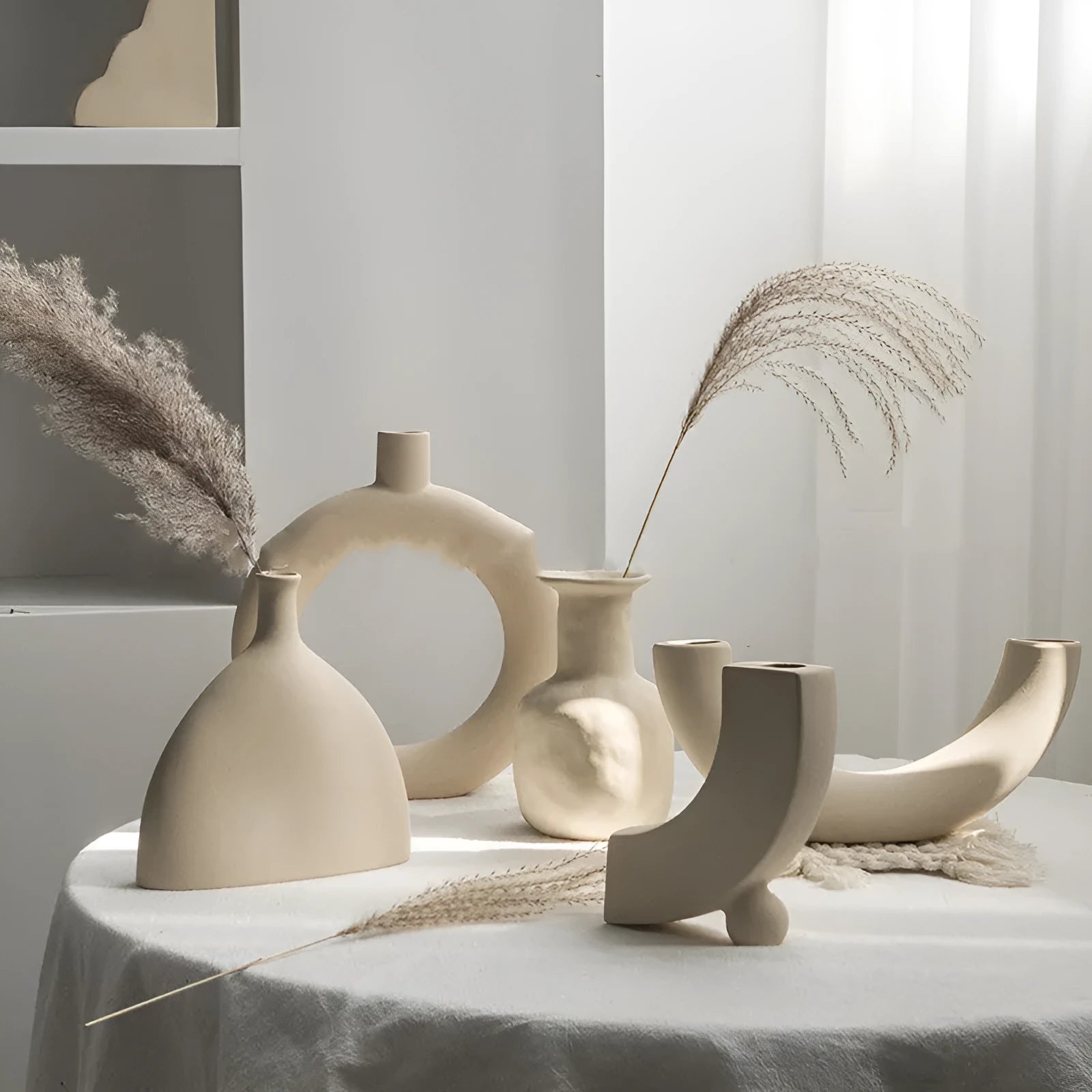 Unglazed matte ceramic vase for dry flower arrangements in Nordic style
