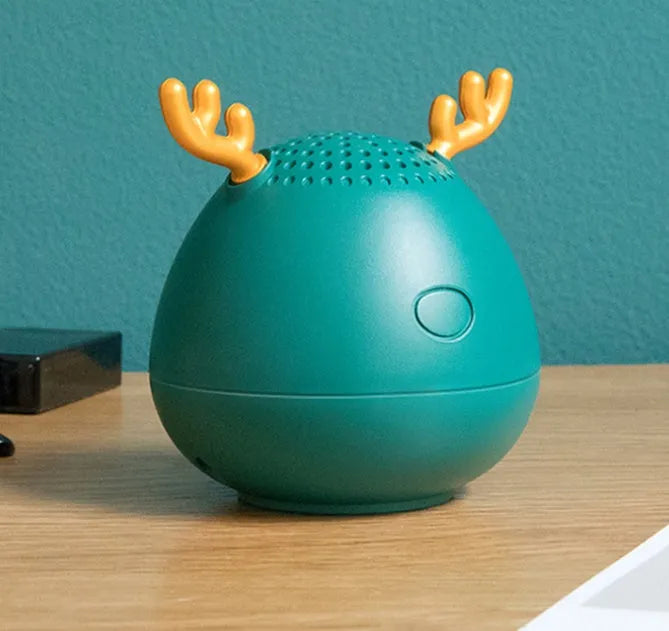 Small portable Bluetooth speaker in green colour showing compact design with USB port