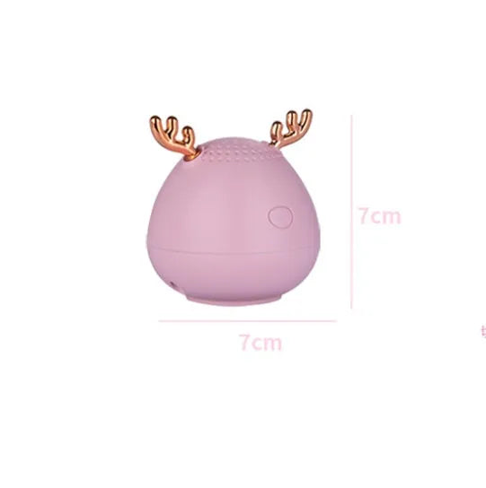 Small portable Bluetooth speaker in green colour showing compact design with USB port