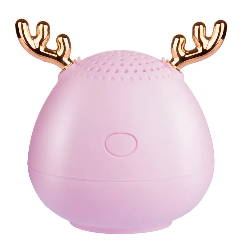 Small portable Bluetooth speaker in green colour showing compact design with USB port