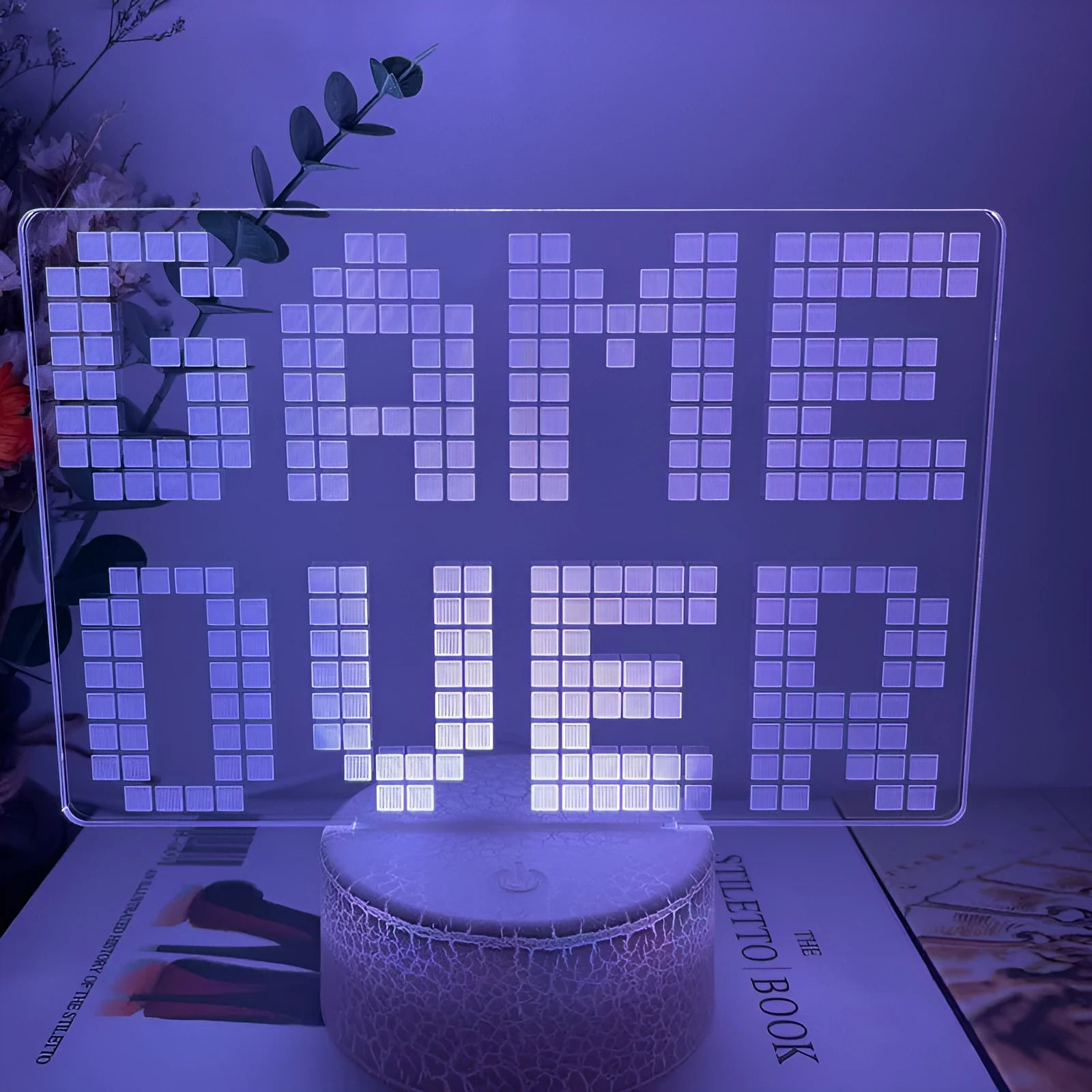 Gamepad-shaped LED desk lamp with acrylic shade on ABS base, showing touch controls and USB cable