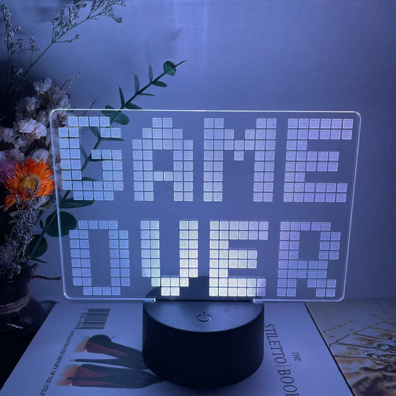 Gamepad-shaped LED desk lamp with acrylic shade on ABS base, showing touch controls and USB cable