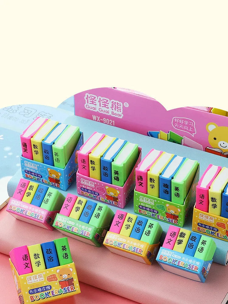 Set of four colourful cartoon book-shaped erasers for student prizes and gifts.