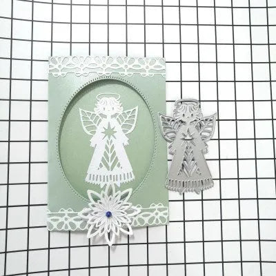 White carbon steel knife mould with an angel figure design for card embossing, 8cm by 6cm.
