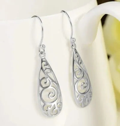 White carved drop shape stud earrings in platinum colour made from environmentally friendly copper