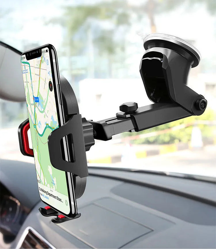 Car phone navigation bracket with red silicone suction cup mounted on car dashboard