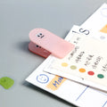 Acrylic decorative collage clips with cartoon designs in beige, blue, orange, and pink colours