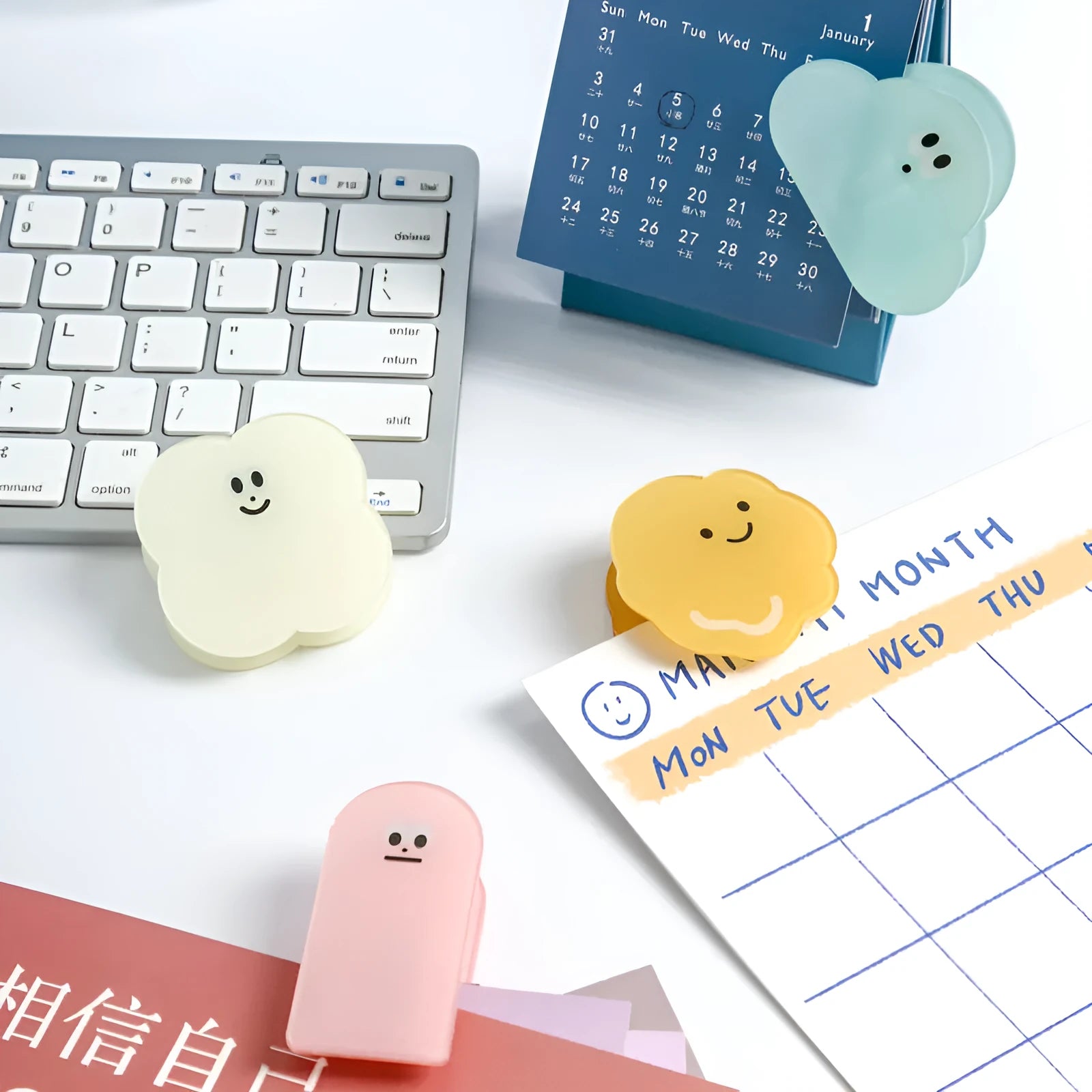 Acrylic decorative collage clips with cartoon designs in beige, blue, orange, and pink colours