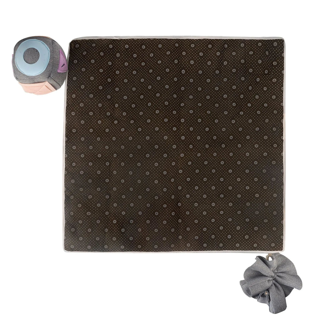 Grey cloth pet sniffing pad with two snuffle toys on a surface, designed for dog foraging and stress relief
